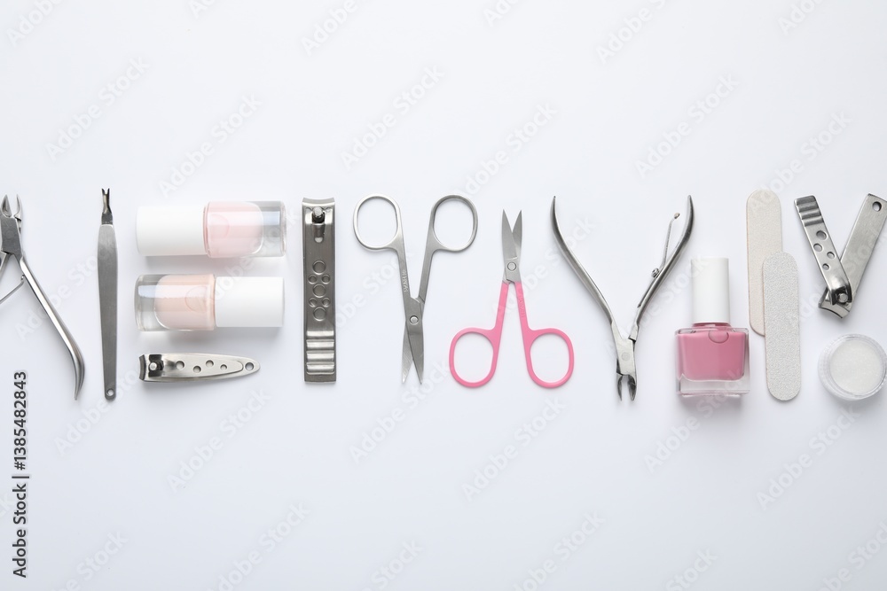 Set of different manicure tools on white background, flat lay