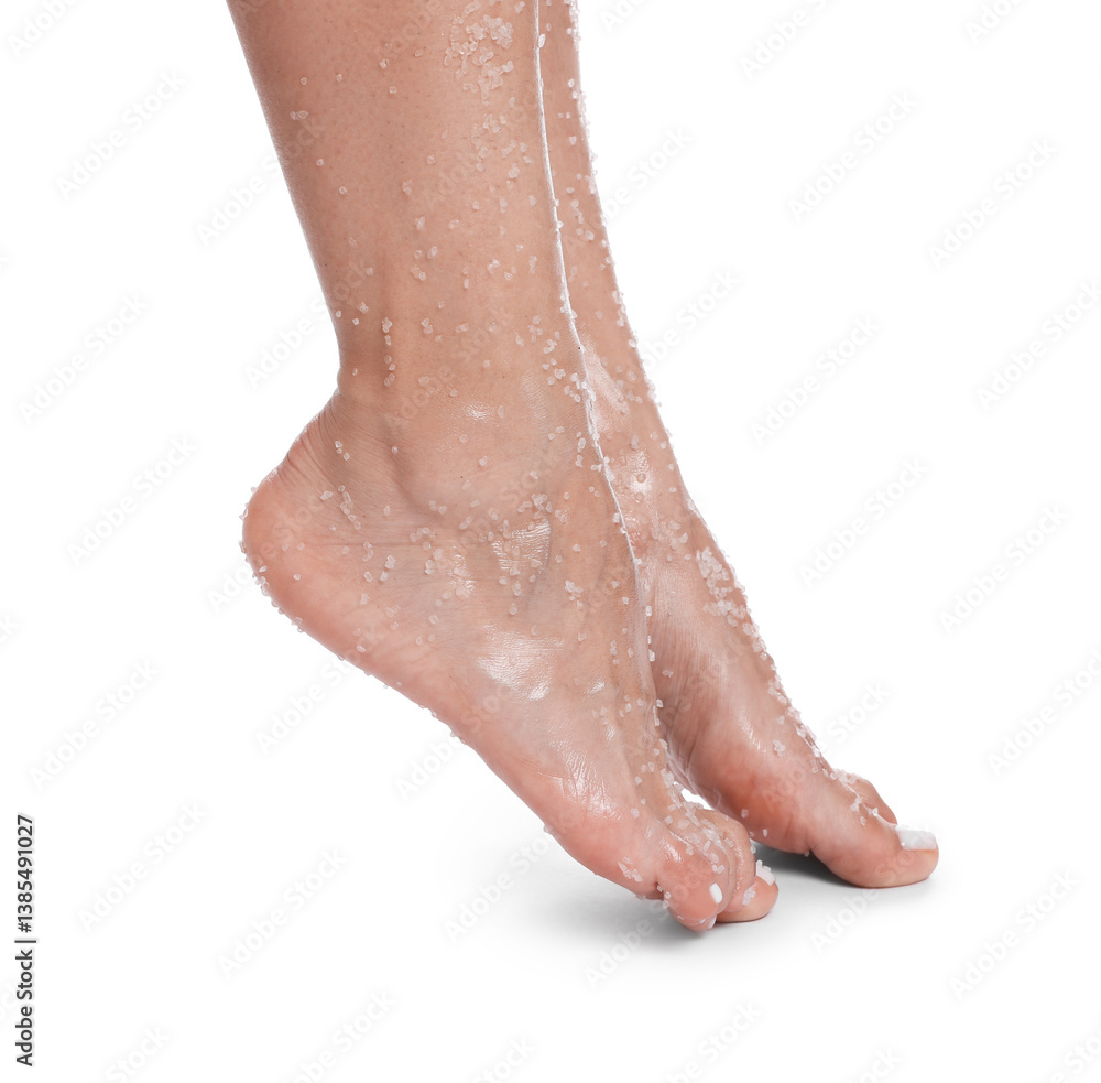 Fototapeta premium Woman with body scrub on her feet against white background, closeup