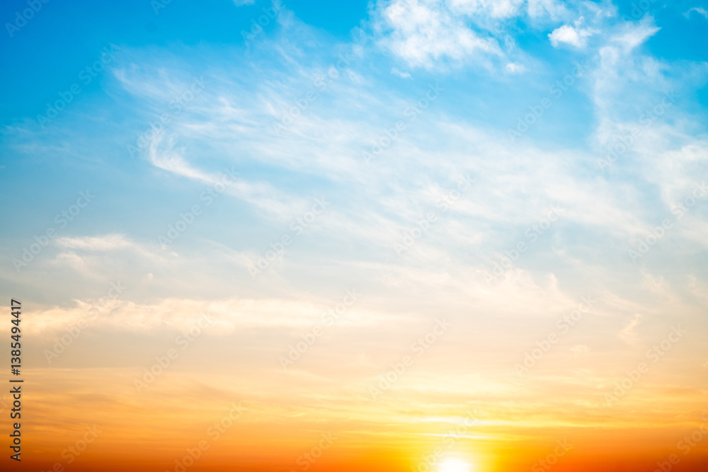 Obraz premium Beautiful , luxury soft gradient orange gold clouds and sunlight on the blue sky perfect for the background, take in evening,Twilight, Large size, high definition landscape photo