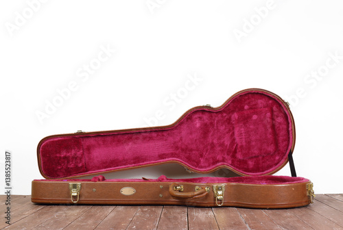 Musical instrument - Side view Open brown electric guitar hard case
