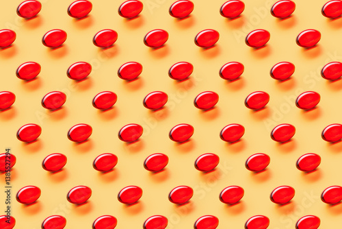 Red Capsules Pattern on Orange Background, Top View