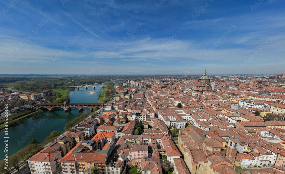 Aerial view of Pavia and the Ticino River. View of the Cathedral of Pavia, Covered Bridge and the Visconti Castle. Lombardia, Italy