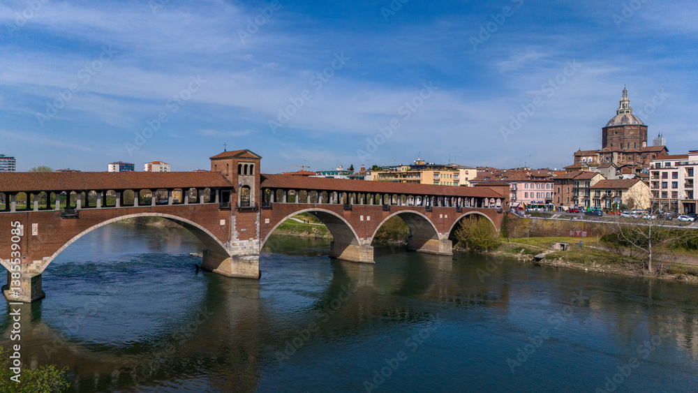 Aerial view of Pavia and the Ticino River. View of the Cathedral of Pavia, Covered Bridge and the Visconti Castle. Lombardia, Italy