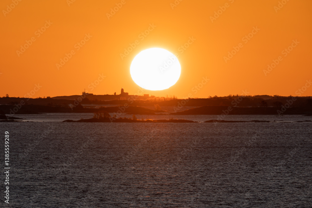 Golden sunrise over the sea and islands during a sea cruise on the way to Sweden. Golden sunrise over the sea and islands during a sea cruise on the way to Sweden.