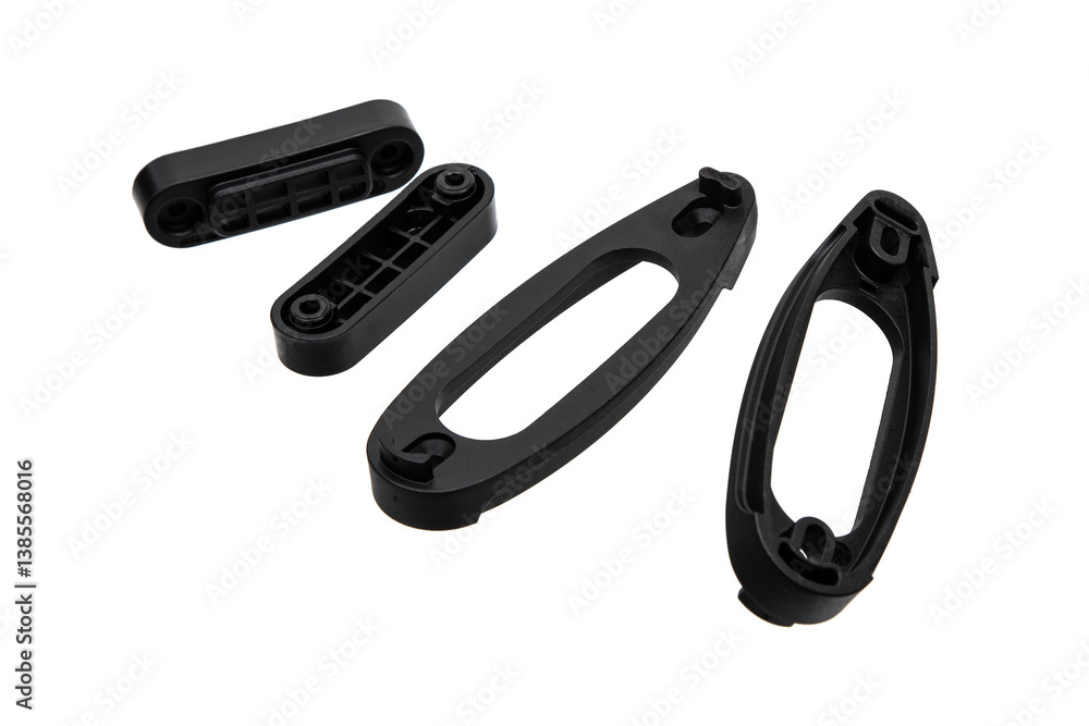 Black plastic spacers designed for extending the stock of rifles or shotguns, isolated on a white background. Black plastic spacers designed for extending the stock of rifles or shotguns, isolated on a white background.