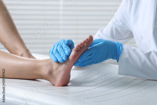 Konstfotografi Doctor examining patient's foot in hospital, closeup