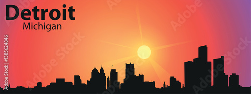 The black silhouette of the city of Detroit, Michigan against the backdrop of a picturesque sunset	