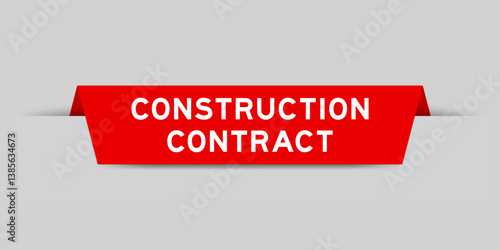 Red color inserted label with word construction contract on gray background