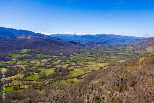 Panorama of Pic des Trois Seigneurs on the horizon and the Douctouyre Valley from the Ariège village of Roquefixade in spring