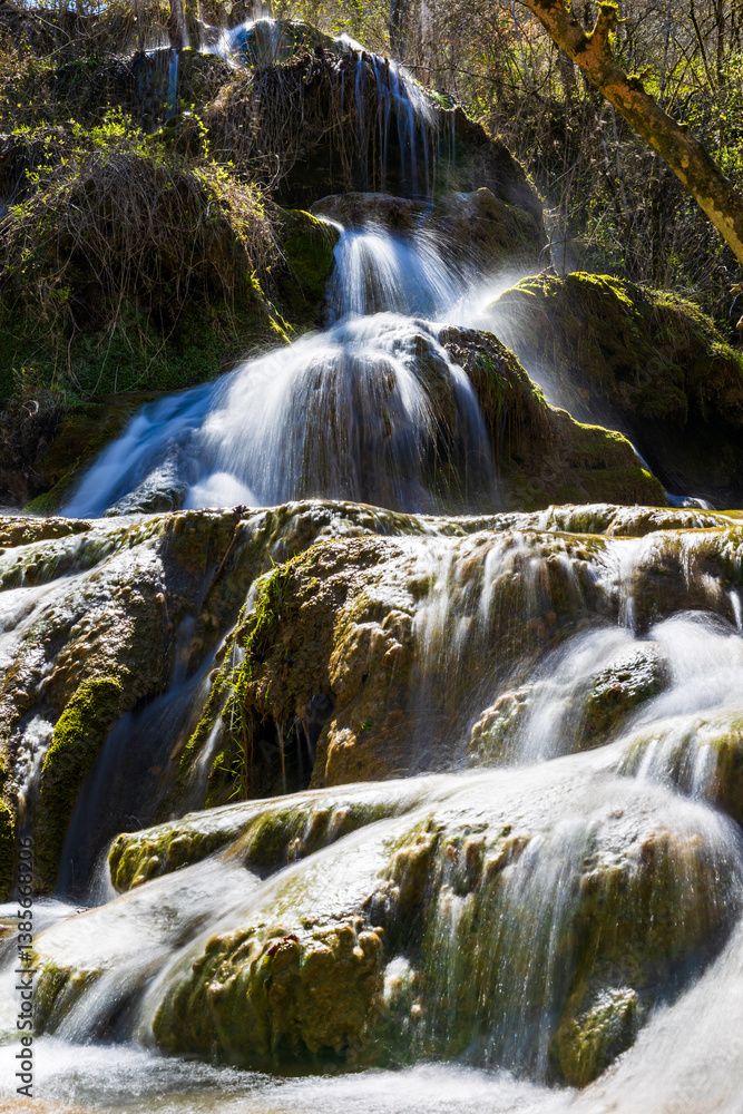 Fototapeta premium Petrifying waterfalls of Roquefort, in Ariège, formed by the water of the Turasse springs
