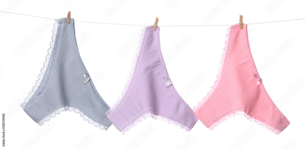 Fototapeta premium Beautiful panties on clothes line against white background