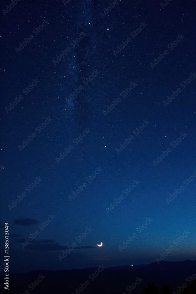 Fototapeta premium Dark vastness of starry night sky with numerous twinkling stars and a bright crescent moon hanging low in the distance , celestial bodies, black sky, galaxy
