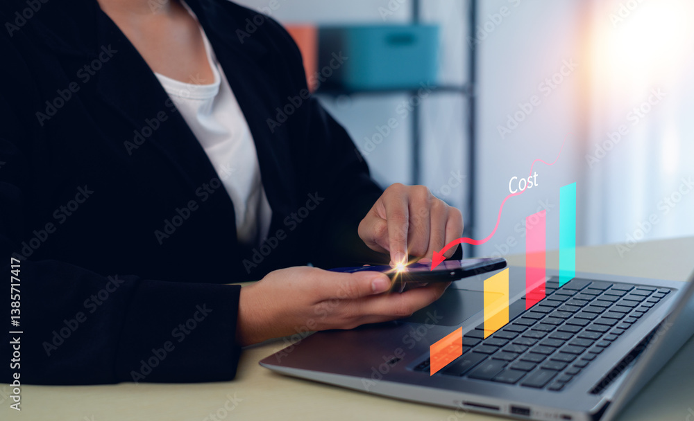 Business pointing down arrow of the graph with cost reduction business finance on virtual screen. Cost reduction concept. Business pointing down arrow of the graph with cost reduction business finance on virtual screen. Cost reduction concept.