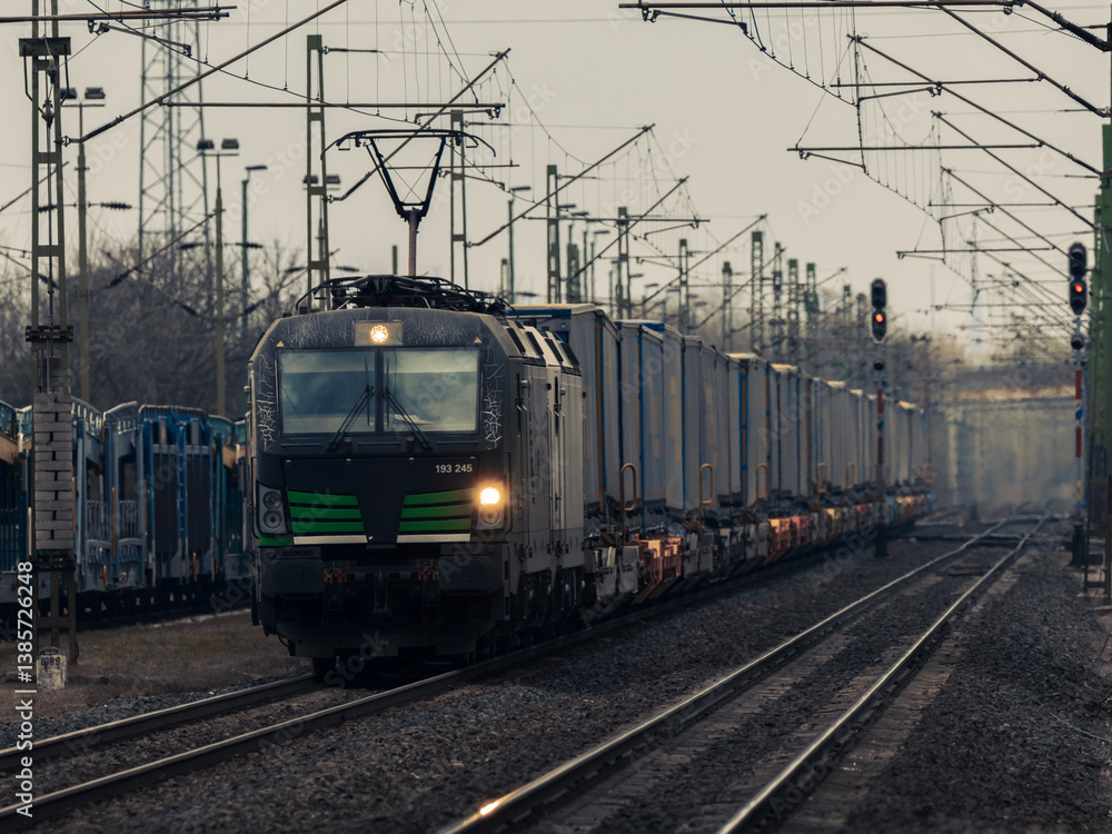 Modern freight train approaching on railway tracks
Modern freight train approaching on railway tracks