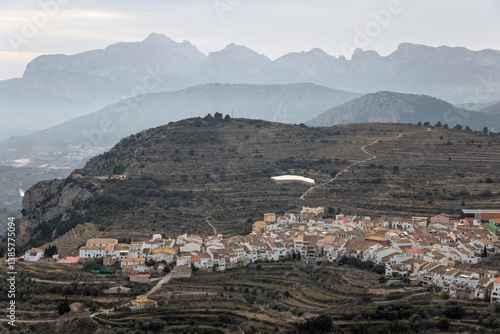 Tableau sur toile view over white town of Tarbena in terraced landscape, Tarbena, Alicante Provinc