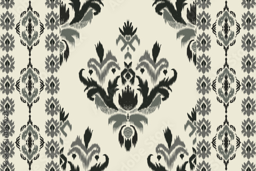 Seamless Ikat fabric pattern in grey and black tones with floral patterns. Suitable for fabric, wallpaper, carpet, gift wrapping paper, home decor, fashion and crafts.