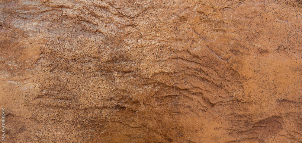 Fototapeta premium Rock Stone texture background, Rough surface brown wall material pattern for design natural stone wall banner