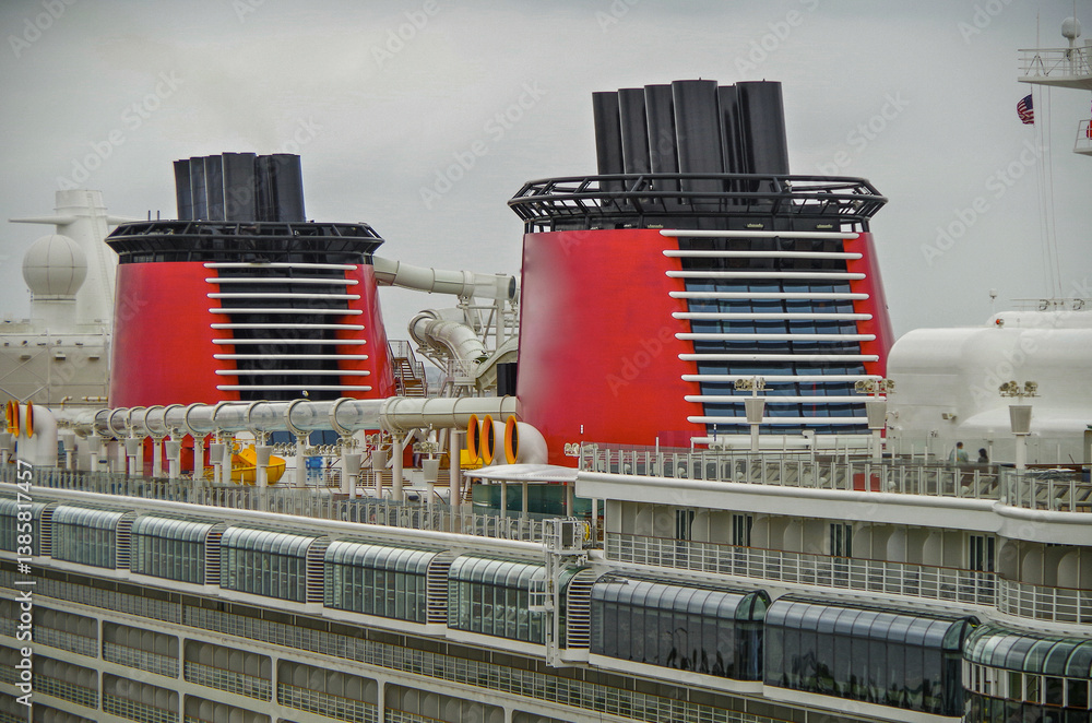 Close up view of outdoor promenade top deck with funnels and waterslide of modern family cruiseship cruise ship liner Fantasy or Dream