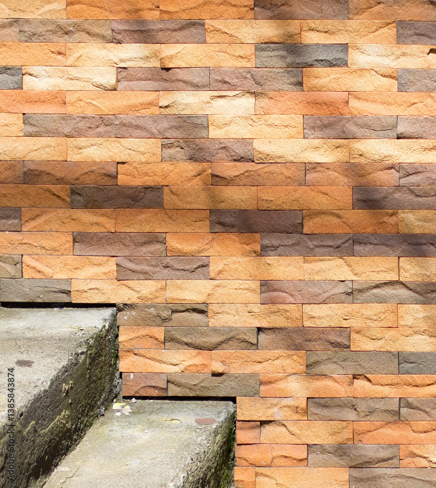Close-up of textured stone tiles in warm earthy tones at a Medellín, Medellin street, Antioquia, Colombia. Highlighting intricate patterns and natural contrasts with a rustic charm