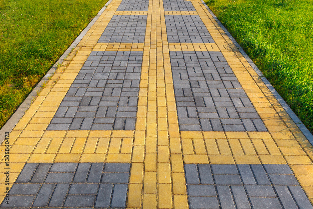 Fototapeta premium A walking path lined with yellow and black tiles