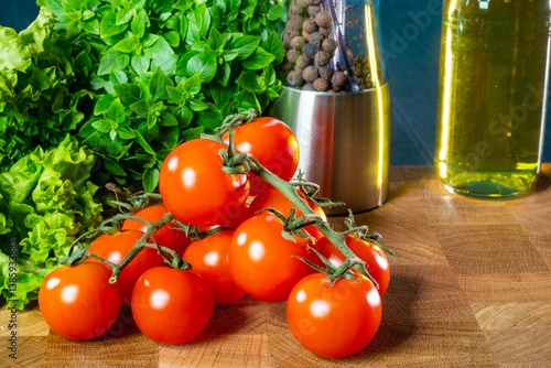 Cherry tomatoes on branch. ...
