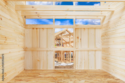 Frame of wooden house under...