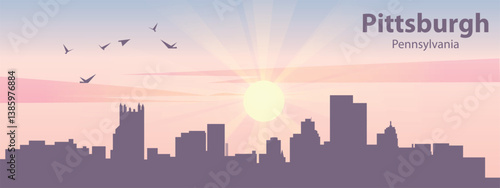 The silhouette of the city of Pittsburgh, Pennsylvania against the backdrop of the sunset and pink clouds. It is also made in pastel colors