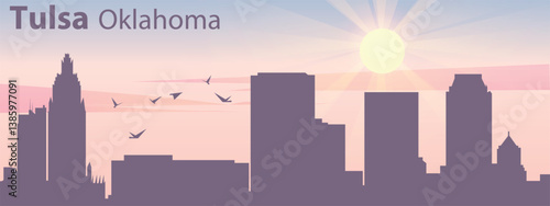 The silhouette of the city of Tulsa, Oklahoma against the backdrop of the sunset and pink clouds. It is also made in pastel colors
