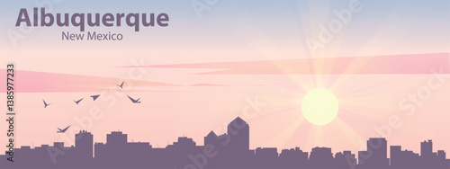 The silhouette of the city of Albuquerque, New Mexico against the backdrop of the sunset and pink clouds. It is also made in pastel colors