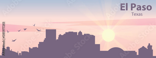 The silhouette of the city of El Paso, Texas against the backdrop of the sunset and pink clouds. It is also made in pastel colors