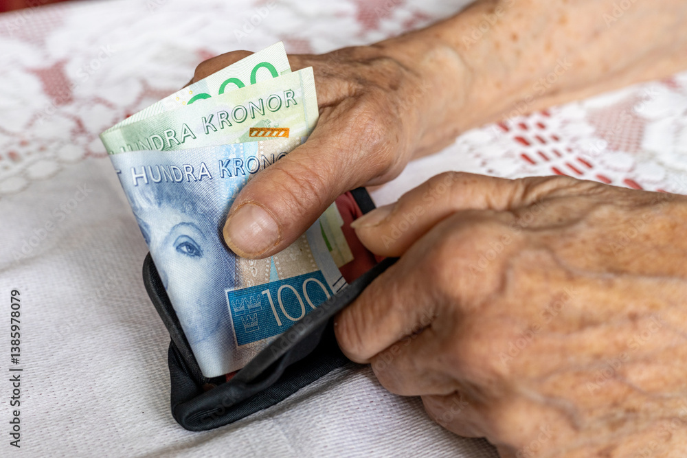 Sweden money. An old woman's hands take money out of her wallet. Swedish kronor. A financial concept. Retirement in Sweden