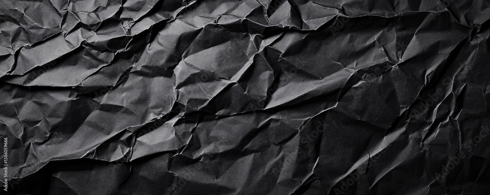 Abstract pattern design created from crumpled black paper texture background Abstract pattern design created from crumpled black paper texture background