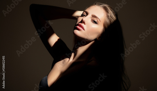 Obraz na płótnie Beauty portrait of beautiful female model, fashion glamour portrait. Beauty female face. Sensual girl with art shadow light. w salonie