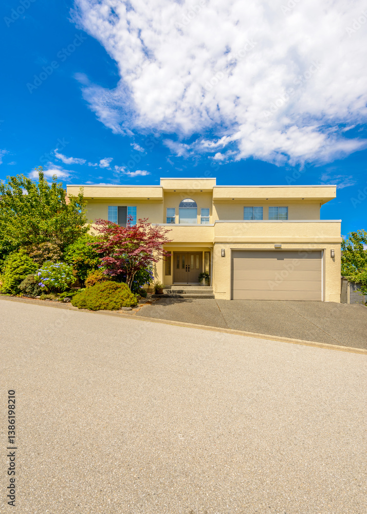 Fototapeta premium Garage door in luxury house with trees and nice landscape in Summer in Vancouver, Canada, North America. Day time on June 2024.