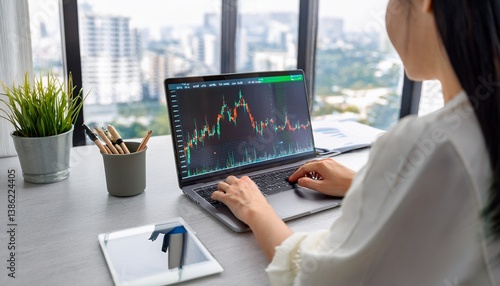 Person analyzing stock charts in a notebook