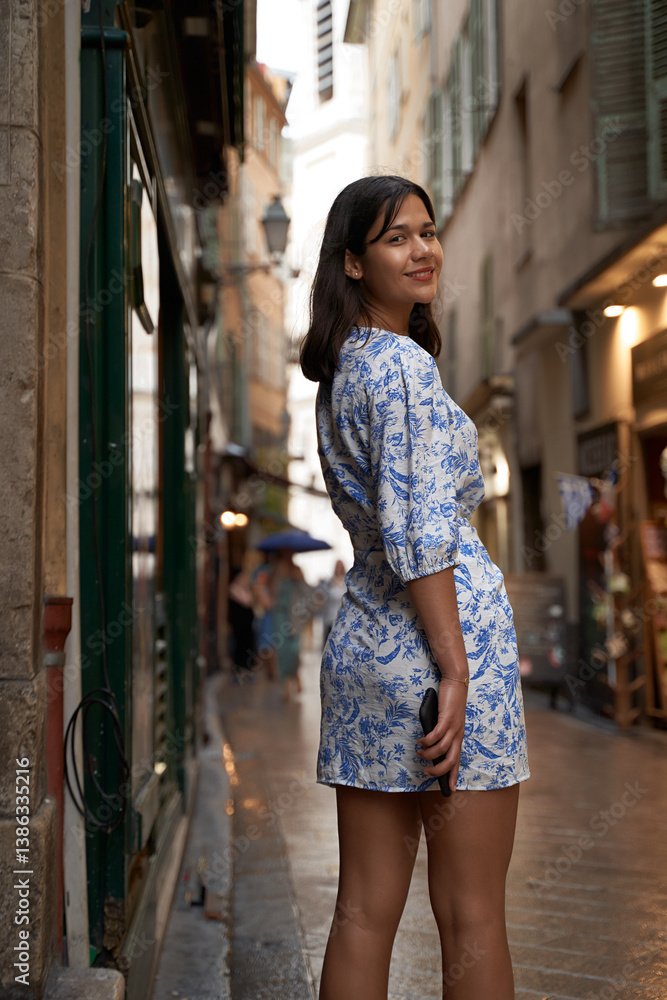Beautiful young mixed race woman in the old town of Nice, France