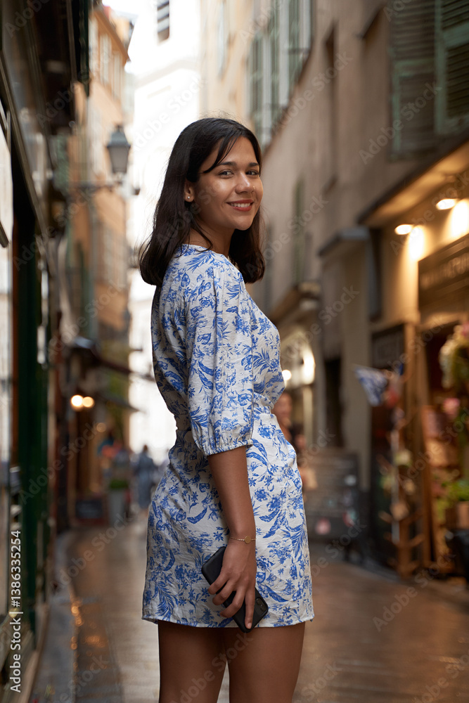 Beautiful young mixed race woman in the old town of Nice, France