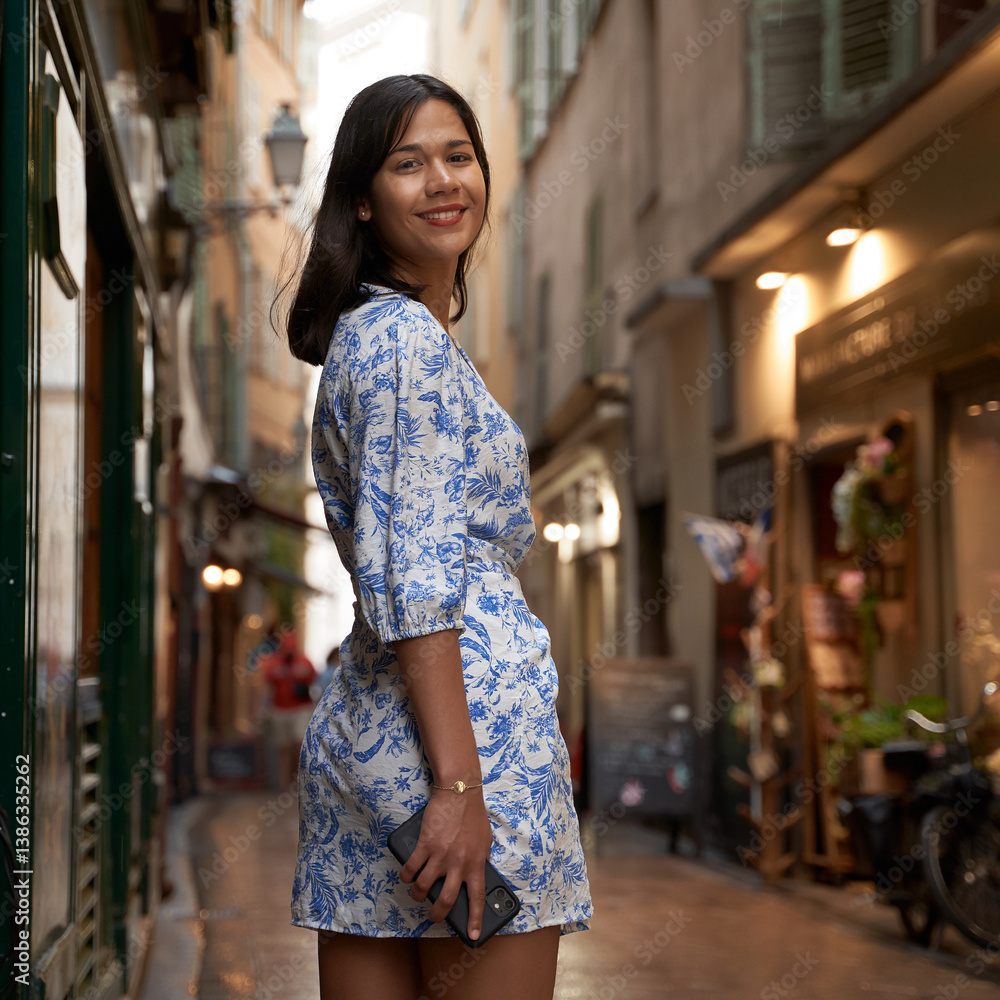 Beautiful young mixed race woman in the old town of Nice, France
