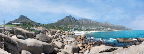 Cape Town, South Africa with Table mountain, Lions Head, Camps Bay and the 12 Apostles - Cinematic Breathtaking travel panorama with peaceful blue sky
