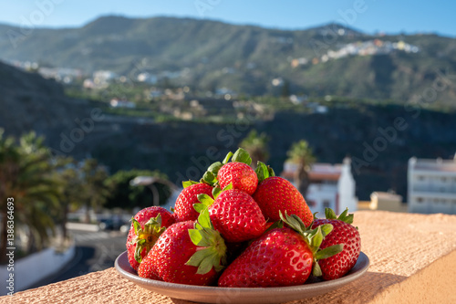 New harvest, plate with bio ripe red sweet strawberry from Tenerife, Canary islands, Spain, vegetarian food local grown fruits