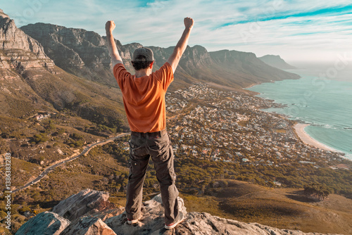 Top of the world - Victory and success. Cape Town hiker reaches summit of Lions Head, Table Mountain. South Africa is best travel and tourism destination for adventure and nature