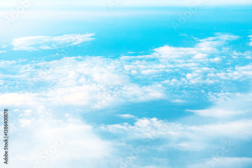 Obraz na płótnie High altitude view of cumulus clouds against a vibrant azure backdrop. aerial soft white clouds drifting across blue sky. Serene panorama of clouds and sky, showcasing a tranquil atmosphere w salonie