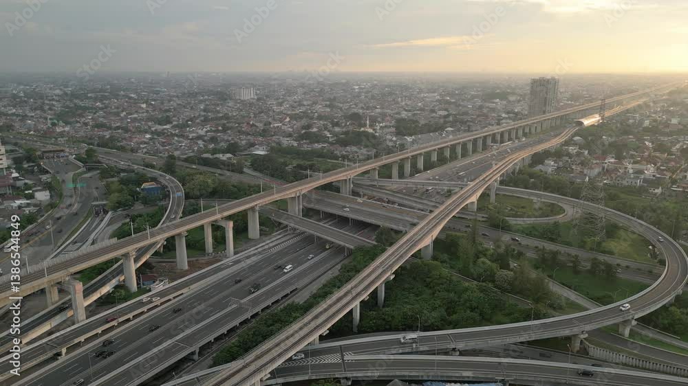 Aerial view of multi-lane highways and flyovers in the setting sun Aerial view of multi-lane highways and flyovers in the setting sun