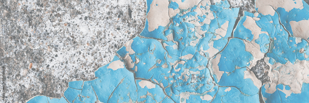 Blue peeling paint on the wall. Old concrete wall with cracked flaking paint. Weathered rough painted surface with patterns of cracks and peeling. High resolution texture for background and design.