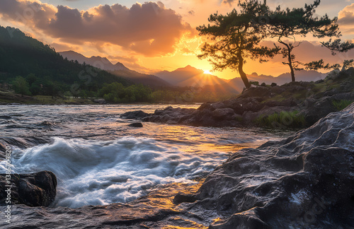Wallpaper Mural Golden Sunset River: A breathtaking shot of a river in the setting sun, the golden light reflecting off the water and rocks, with mountains and trees providing a picturesque natural view.  Torontodigital.ca