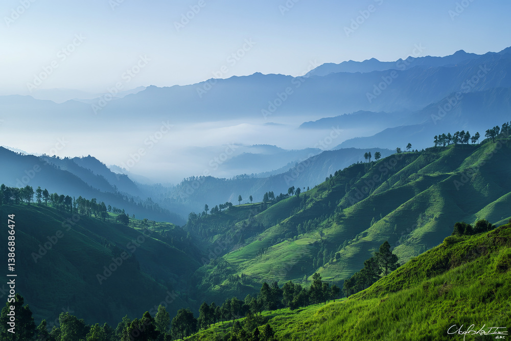 Fototapeta premium A majestic mountain range with misty valleys and lush green hills under early morning light in a serene, cinematic landscape