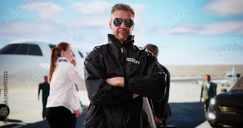 Obraz na płótnie Security Guard Monitoring Private Jet With Walkie-talkie Radio w salonie