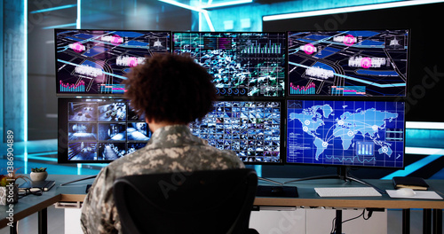 Obraz na płótnie African man monitors real-time surveillance data w salonie