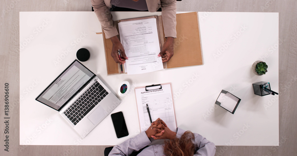 Top Law Office Recruiter Reviewing Young Professional's Resume