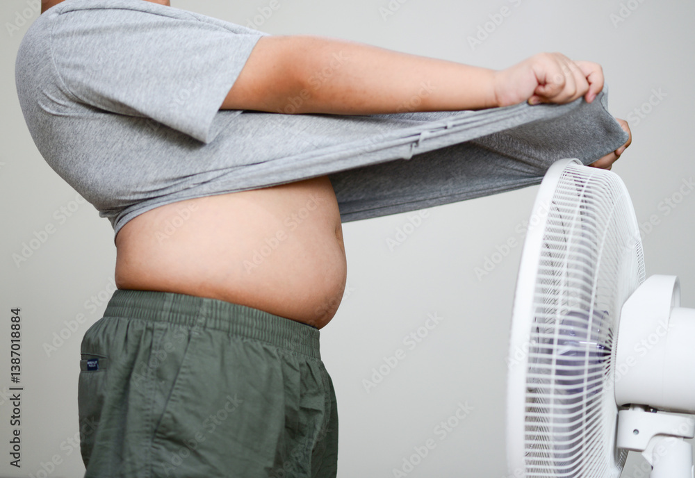 Fan hot weather and children Hot child standing in front of a fan fat child
